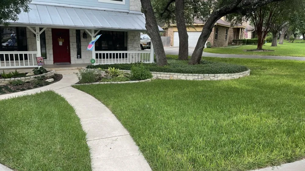 Professional landscape installation for outdoor upgrades in Helotes, TX by Pristine and Green Yards