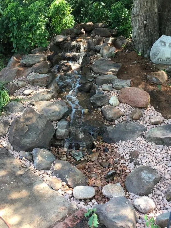 Local yard cleanup service with custom design in Edmond, OK by Pristine LawnScapes