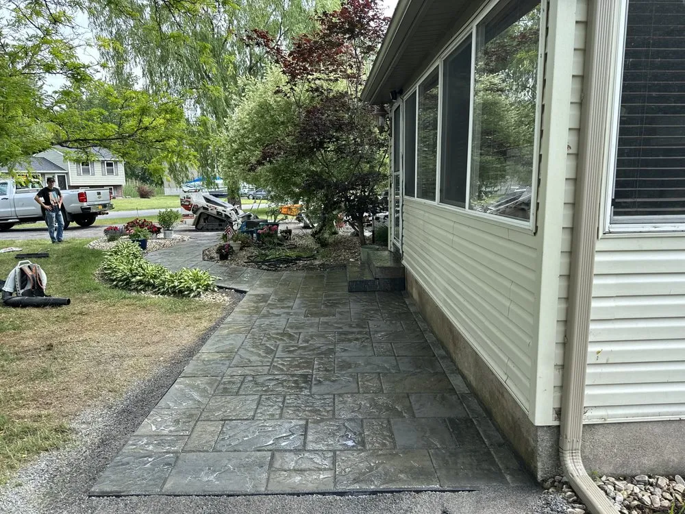 Custom landscape design for residential properties in Clay, NY by Pro Tec Lawn & Landscaping Services