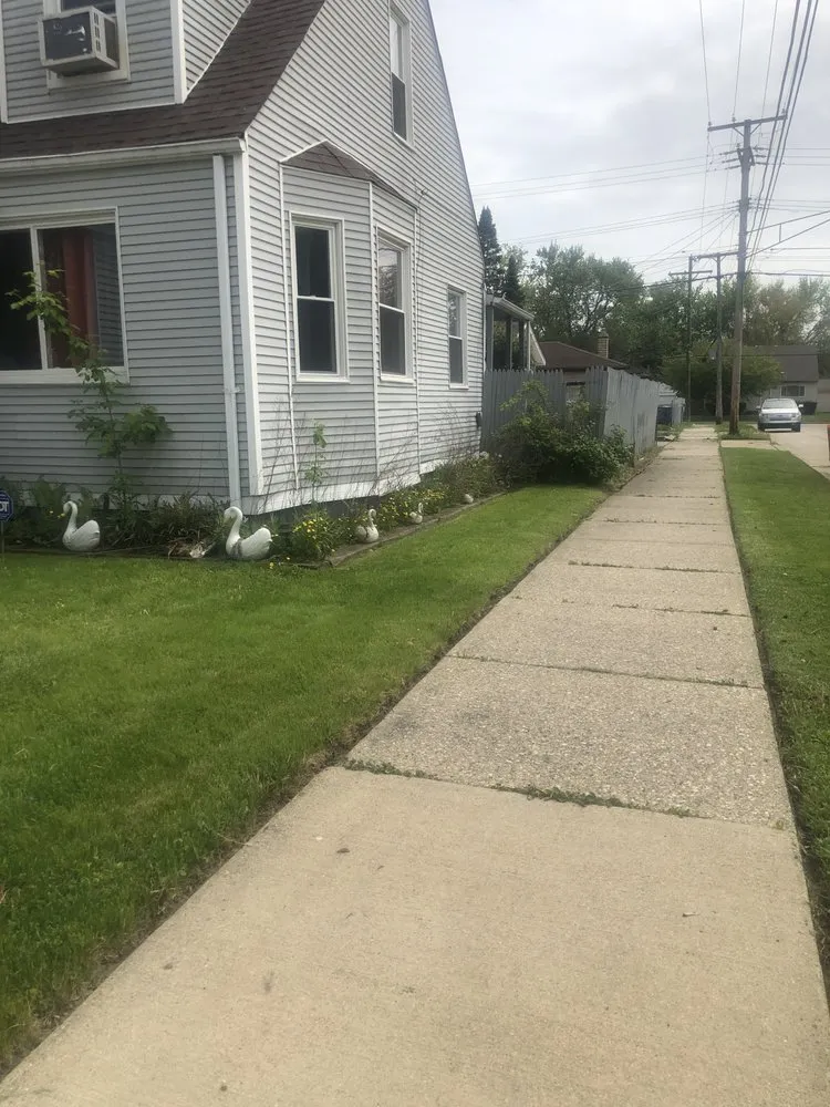 Professional yard cleanup service for year-round maintenance in Detroit, MI by Proline Lawn Manicuring Service