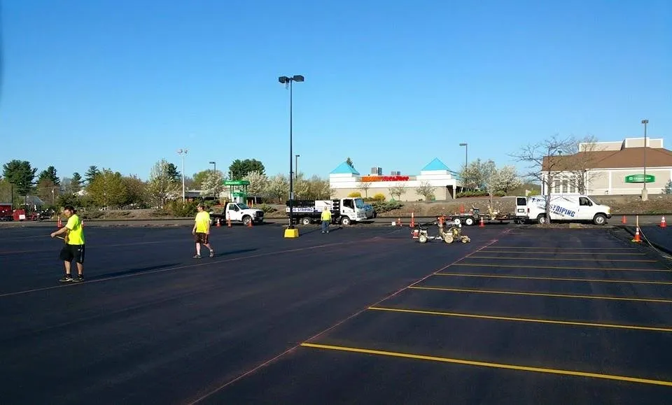 Affordable lawn mowing service in Londonderry, NH by Property Innovation Sealcoating & Line Striping