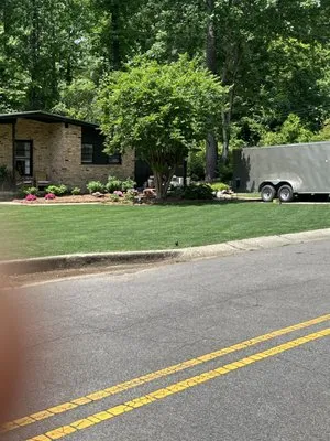 Pulling Strings Lawn Care Logo