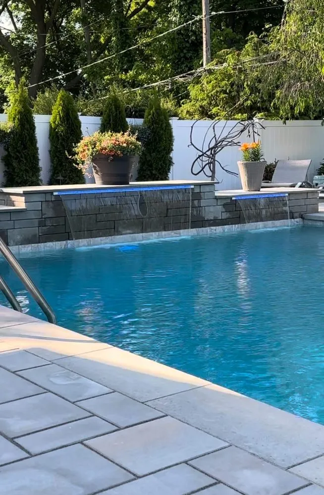 Expert lawn mowing service in East Northport, NY by Pure Masonry & Landscape Contractors