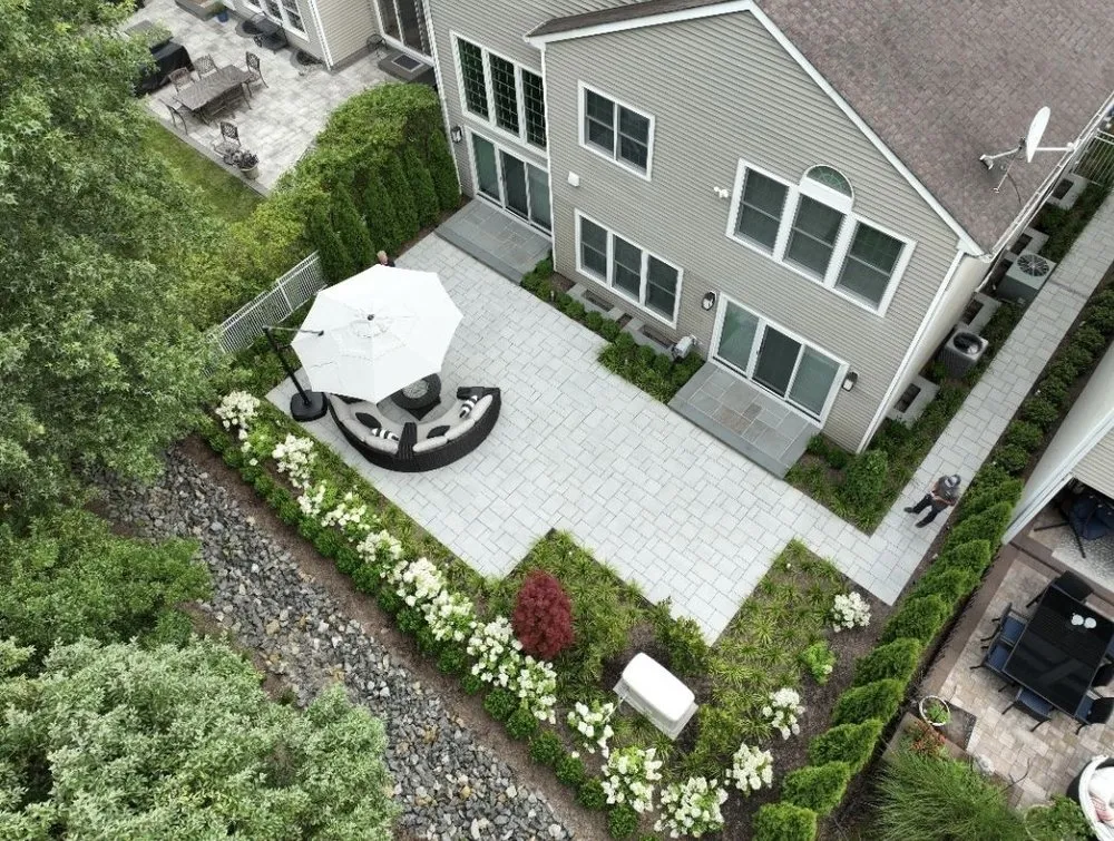 Affordable landscape design in East Northport, NY by Pure Masonry & Landscape Contractors