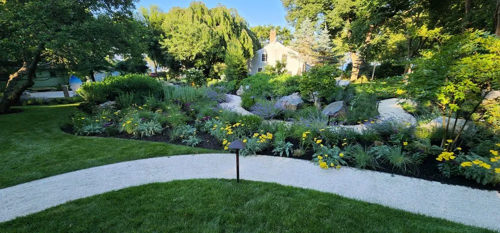 Expert landscape design for residential properties in East Northport, NY by Pure Masonry & Landscape Contractors