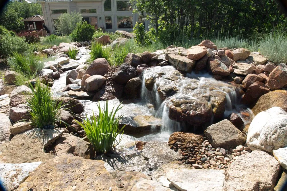 Expert lawn mowing service with custom design in Colorado Springs, CO by Purely Ponds & Waterfalls