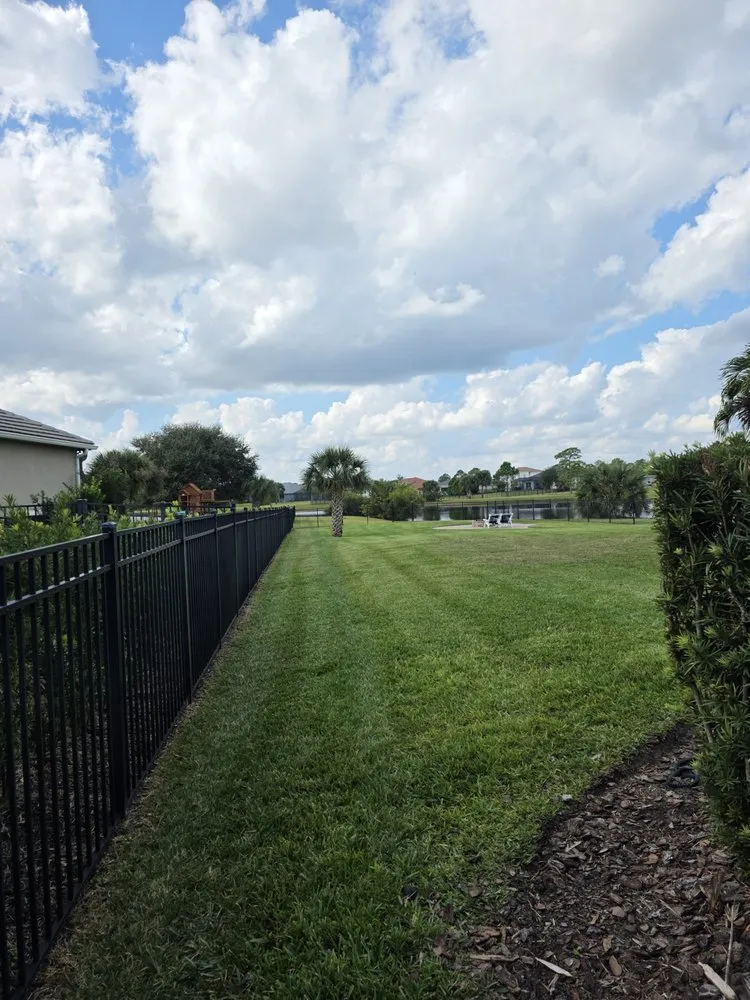 Local lawn mowing service for homes in Cocoa, FL by Q's Lawn and Land Solutions