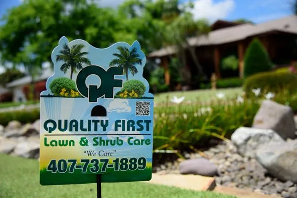 Quality First Lawn & Shrub Care Logo