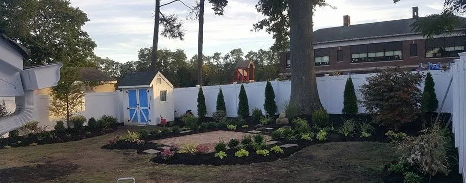 Affordable landscape installation for beautiful yards in Butler, NJ by Quality Garden Designs
