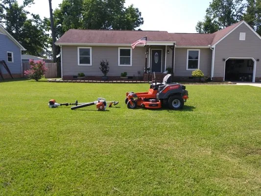 Quality Lawn Care & Pressure Washing Logo