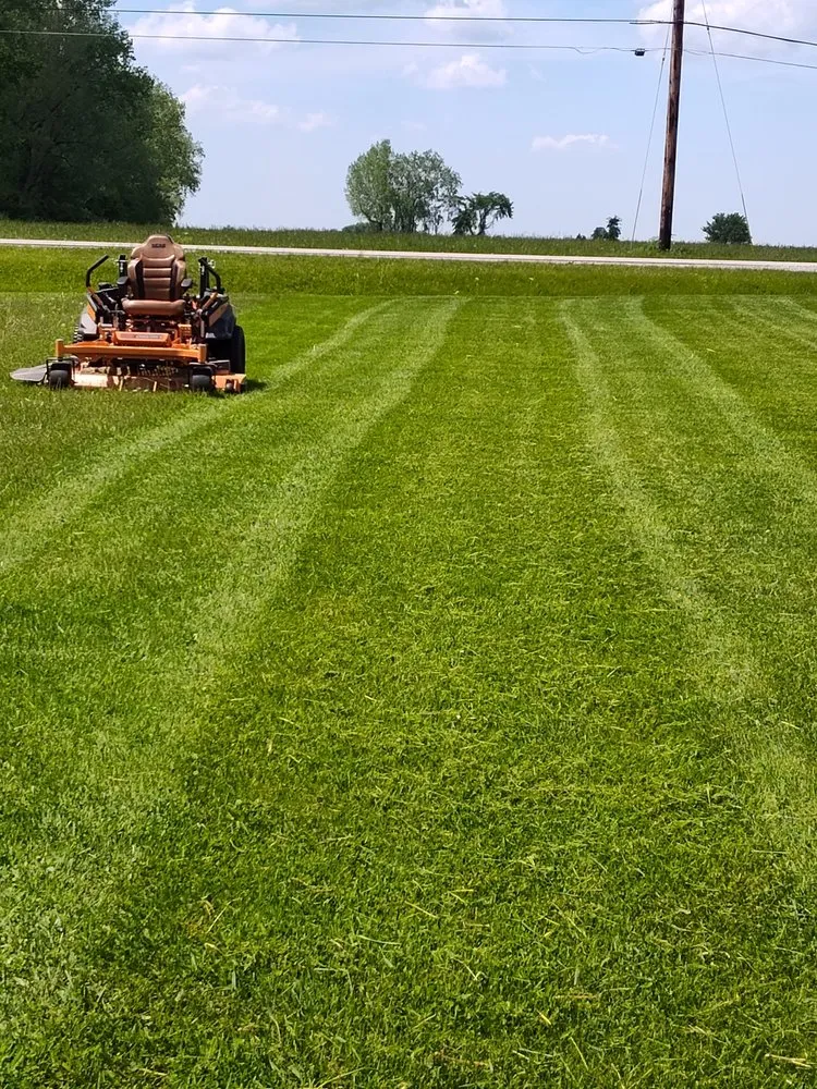Local lawn mowing service in Pinconning, MI by Quality Lawn Care