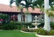 Custom yard maintenance for residential properties in Deerfield Beach, FL by Quality Lawncare & Landscaping