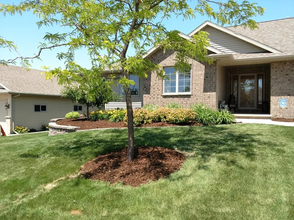 Professional residential landscaping with custom design in Little Chute, WI by Quality Lawncare and Landscape