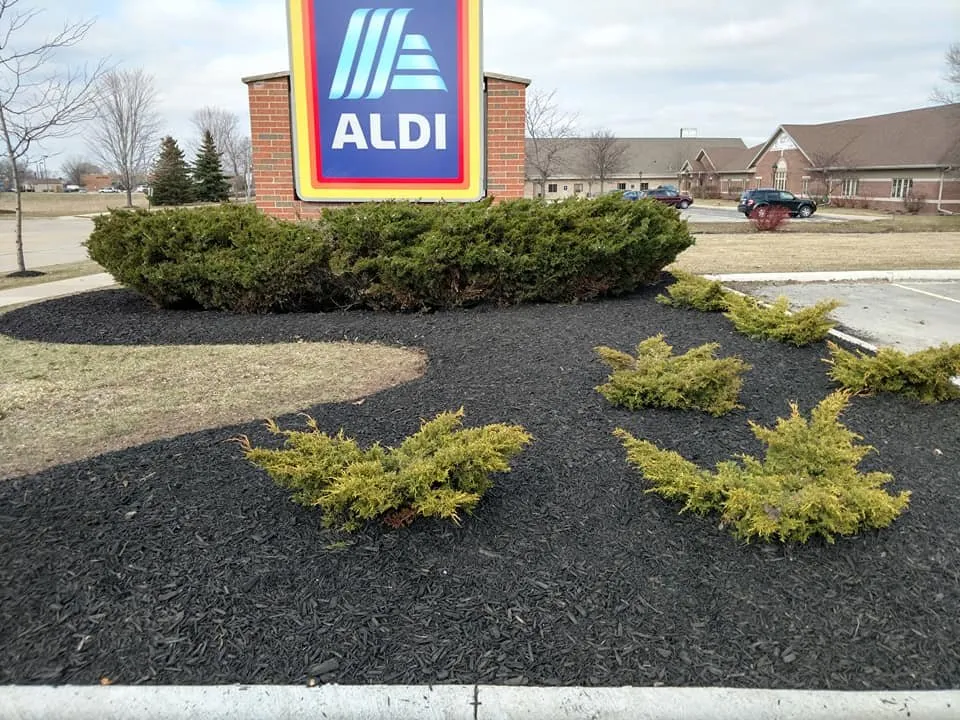 Professional garden landscaping with custom design in Little Chute, WI by Quality Lawncare and Landscape