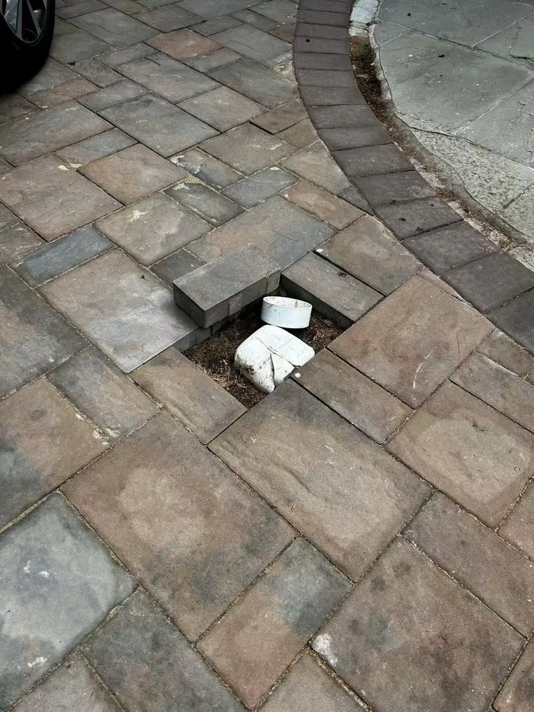 Custom landscape installation for homes in Copiague, NY by Quality Pavers Construction