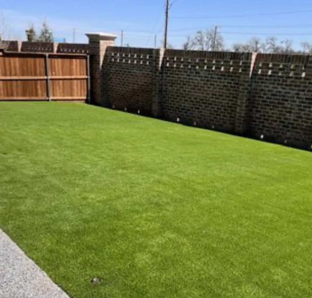 Local landscape installation for year-round maintenance in Greenville, TX by Quick Cut Lawns