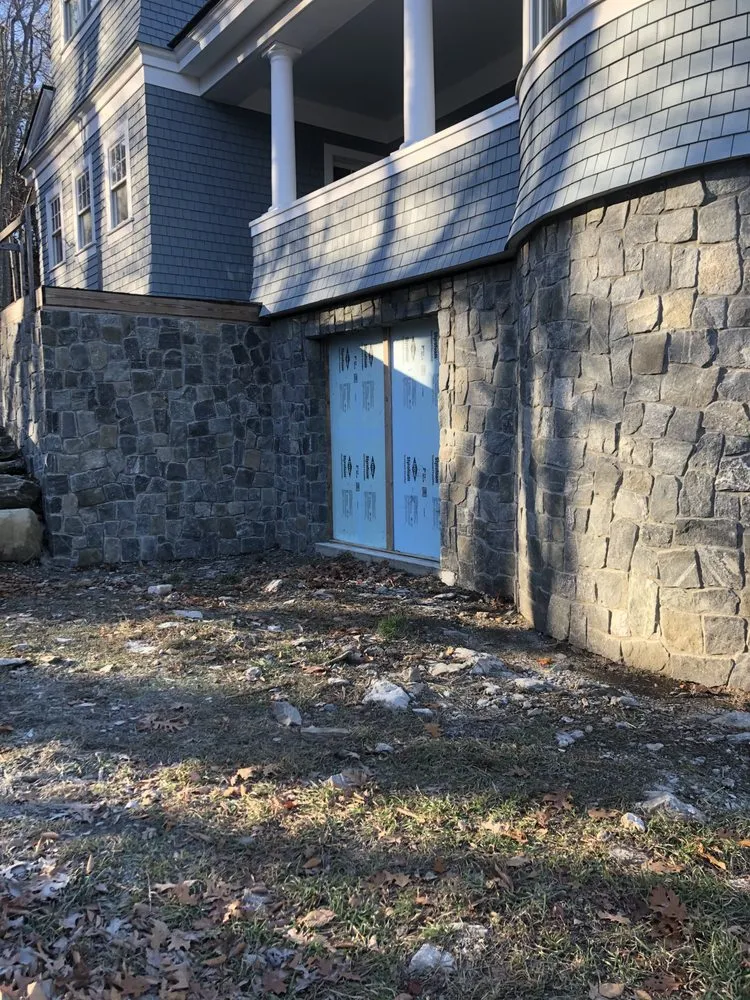 Expert yard cleanup service for year-round maintenance in Westbrook, ME by Quinn's Stoneworks & Landscape