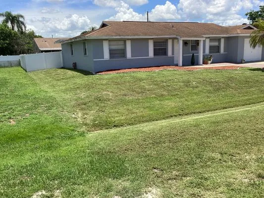 Quintanilla Brothers Lawn Service Logo