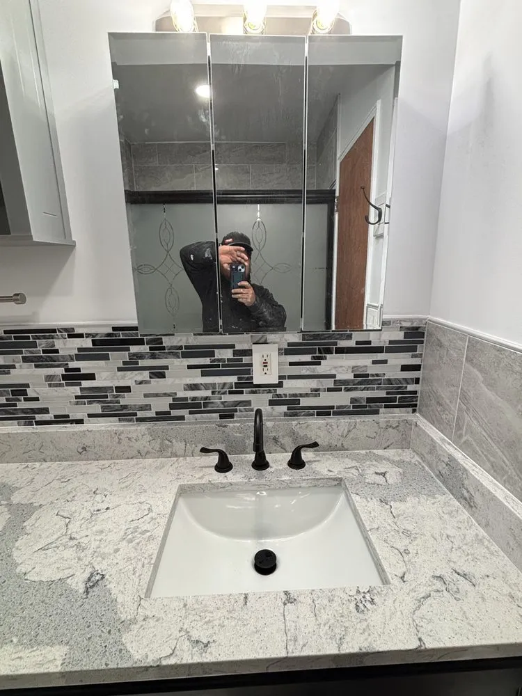 Custom outdoor landscaping in Elmont, NY by R & R Construction & More