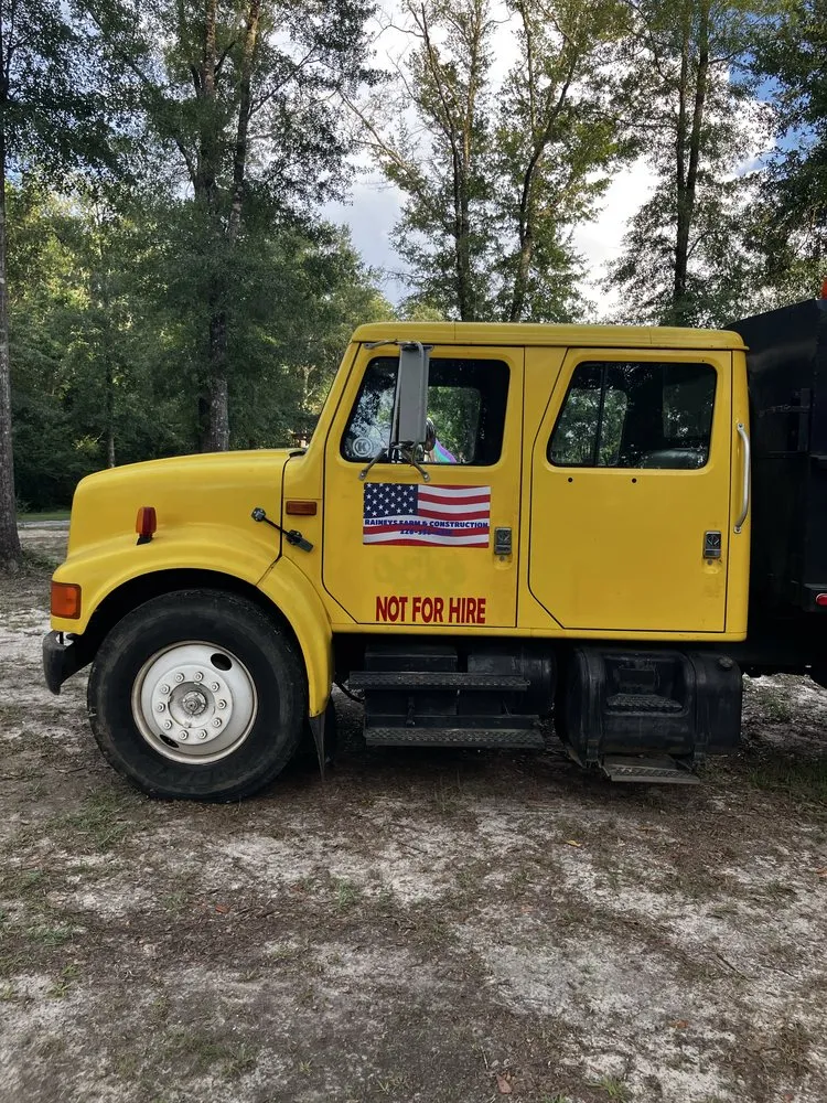 Expert lawn mowing service in Lucedale, MS by Rainey Farms and Construction