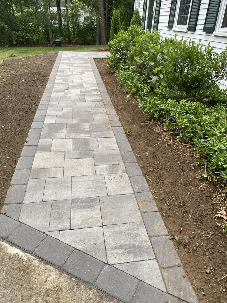 Affordable landscape installation in Holliston, MA by Rainforest Landscape