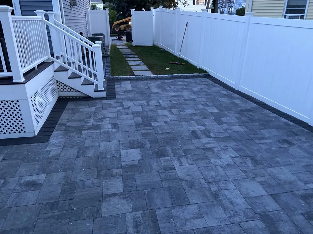 Professional lawn mowing service in Holliston, MA by Rainforest Landscape