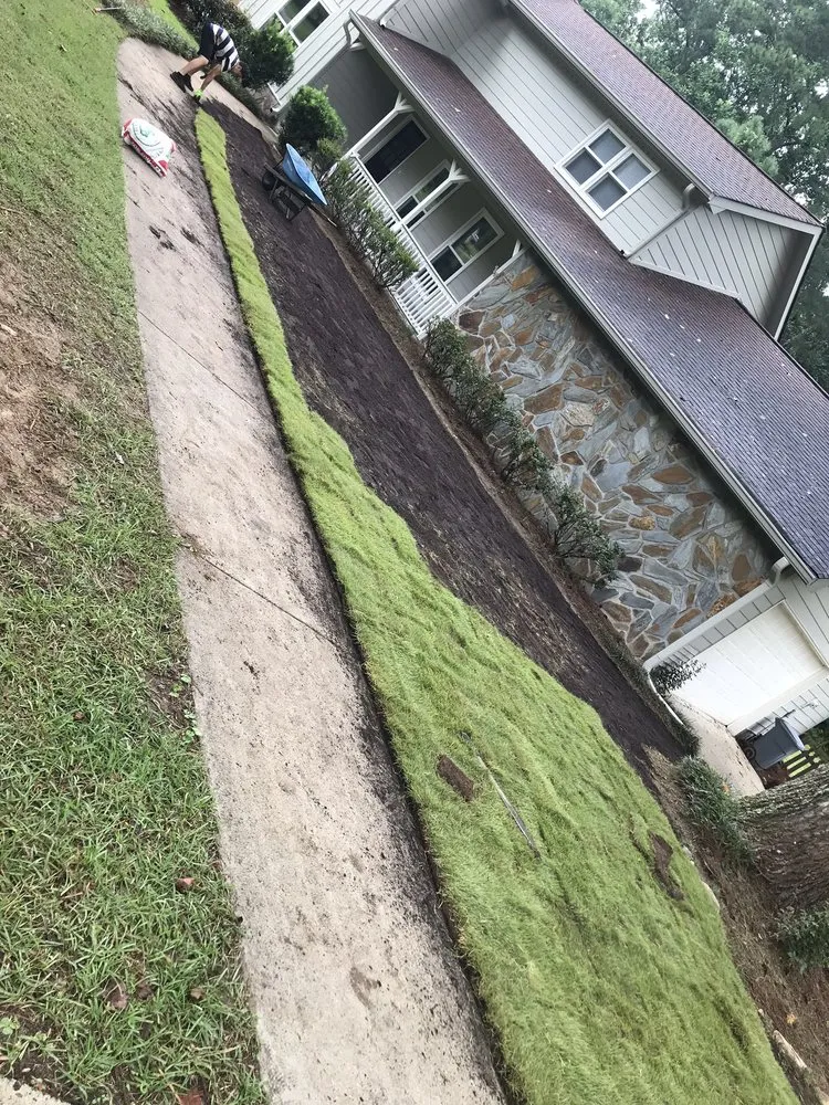 Custom landscape installation with custom design across Carrollton, GA - Ramos Landscaping