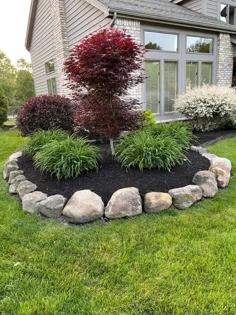 Professional outdoor landscaping with custom design across Penfield, NY - Raspante Enterprise