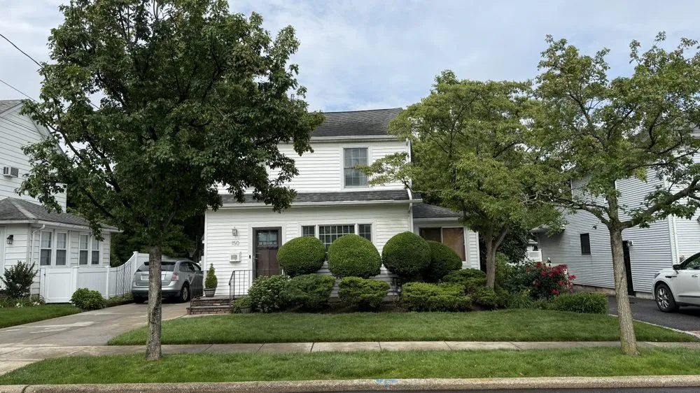 Custom outdoor landscaping in Oceanside, NY by Rath Arborist Services