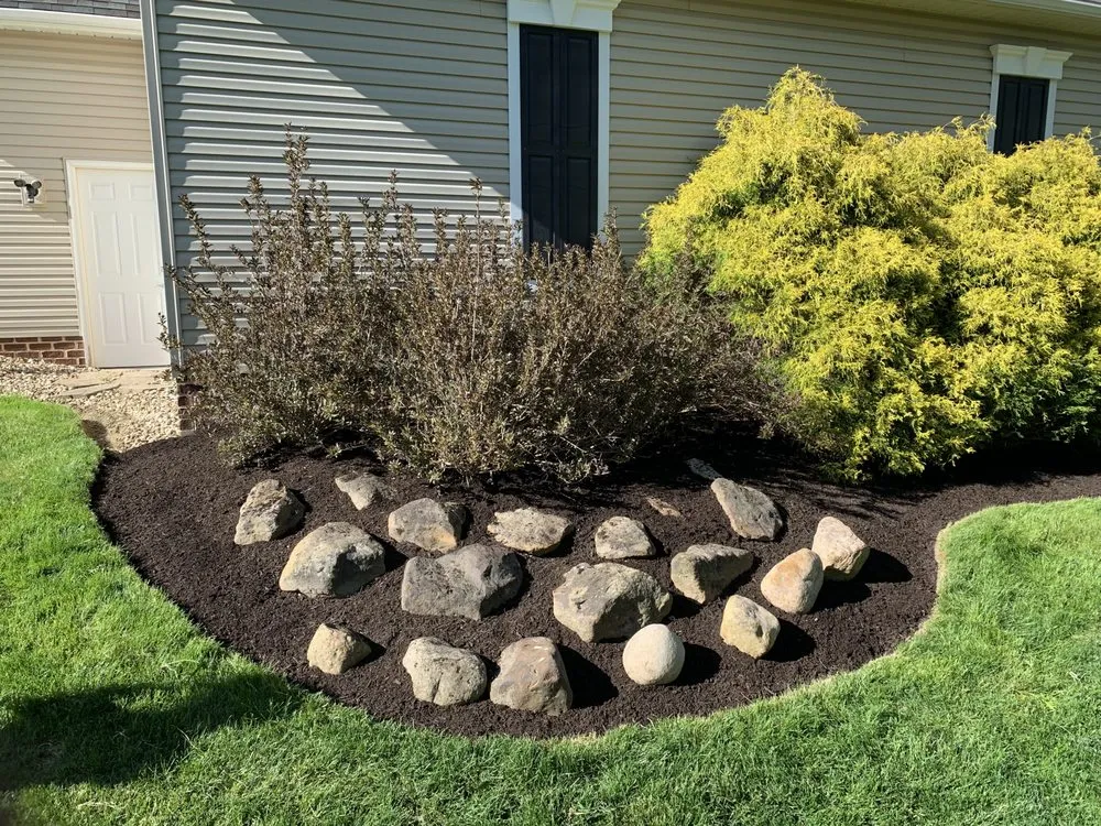 Local yard cleanup service for year-round maintenance in North Canton, OH by Ray Bros Landscaping