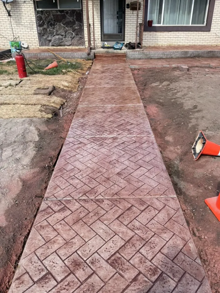 Trusted lawn mowing service with custom design in West Jordan, UT by Razorback Concrete