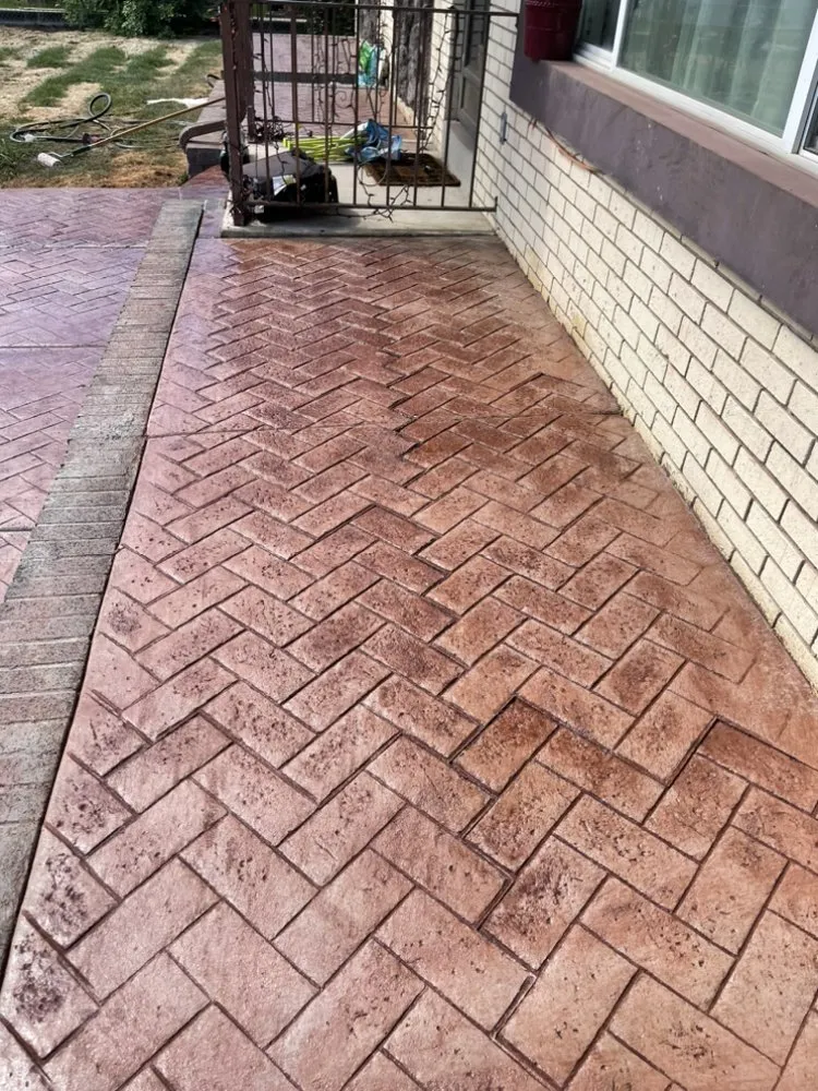 Custom lawn mowing service for outdoor upgrades in West Jordan, UT by Razorback Concrete