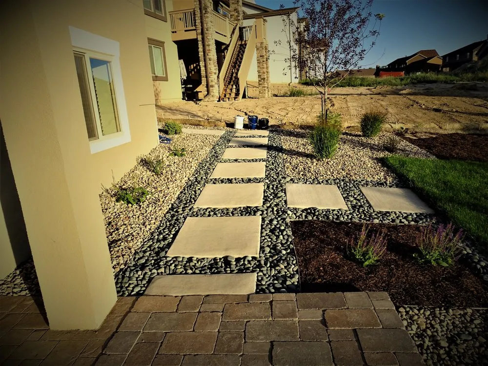 Professional lawn mowing service with custom design across Peyton, CO - RC Custom Landscape and Stonework