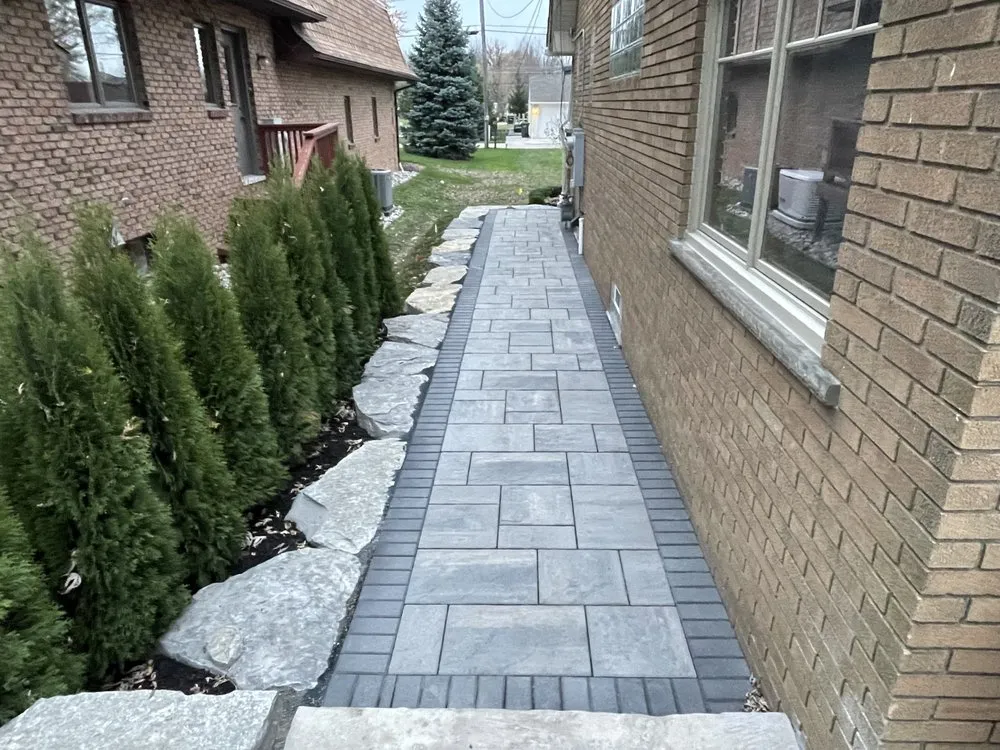 Custom landscape installation with custom design in Utica, MI by RC Lawn Care & Landscaping