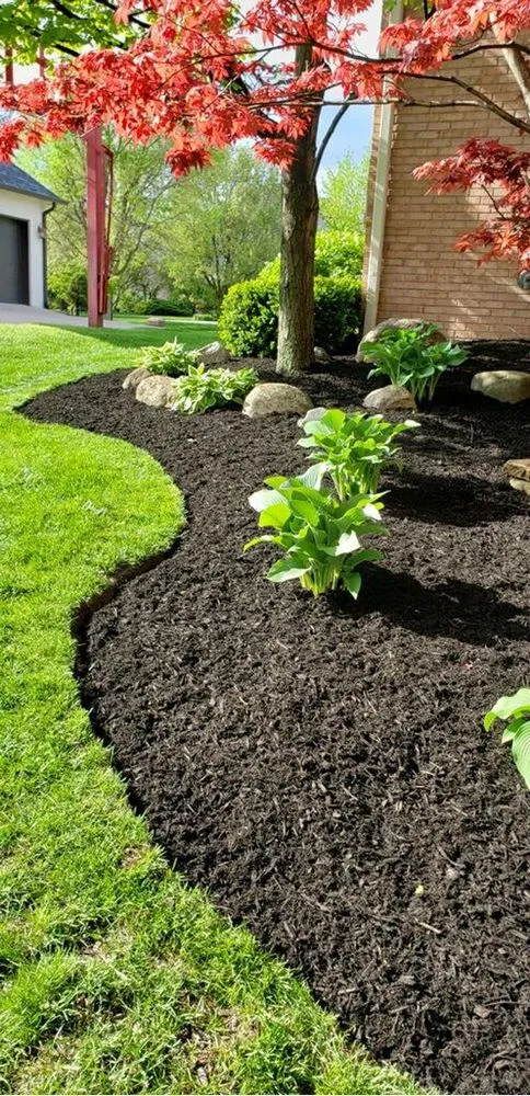 Expert lawn mowing service with custom design across Lawrence, IN - R&C Tree And Landscaping services