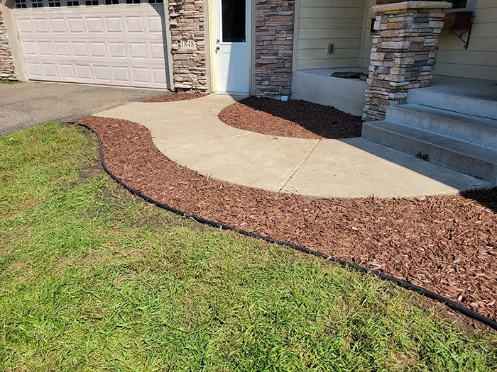 Affordable landscape design for residential properties in Coon Rapids, MN by Ready Pro Lawn