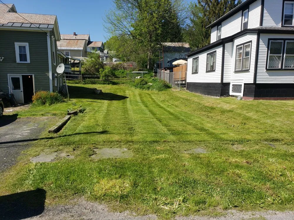 Custom lawn mowing service for year-round maintenance across Granville, NY - Rebel engine's and lawnworks