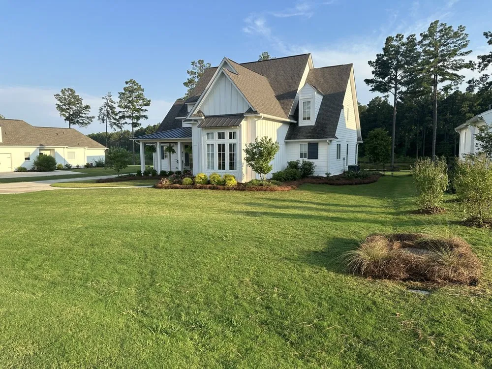 Custom landscape design for beautiful yards in Flora, MS by Red Line Lawn