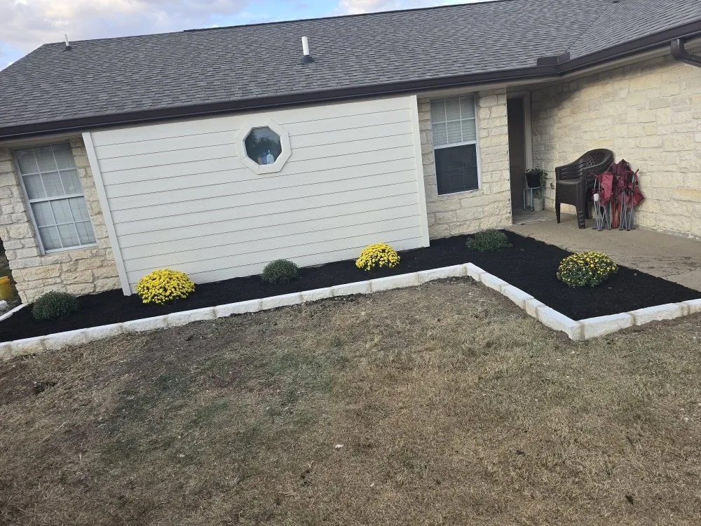 Custom outdoor landscaping in Jarrell, TX by Red Tip Landscaping