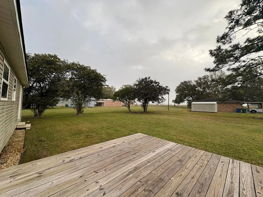 Custom landscape installation in Crowley, LA by Redeemed Lawncare