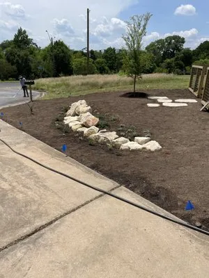 Redrose lawn care and landscape Logo