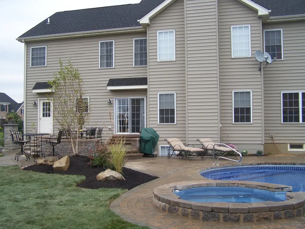 Custom landscape installation with custom design in Whitehall, PA by Redstone Landscaping