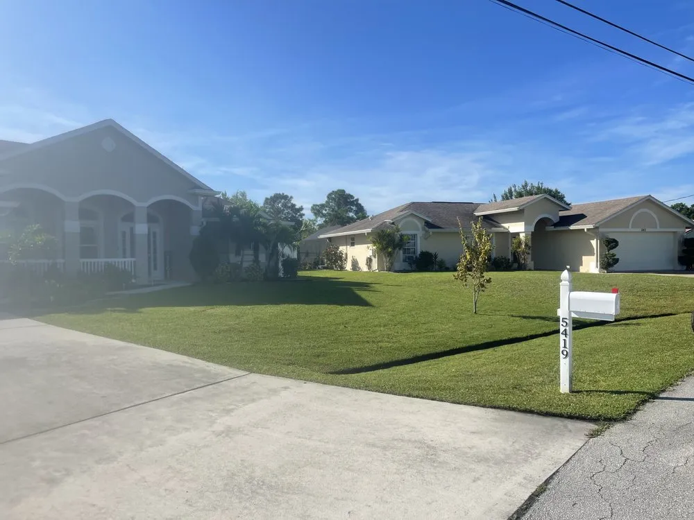 Affordable landscape design for year-round maintenance in Port Saint Lucie, FL by Reggie’s Lawn Service