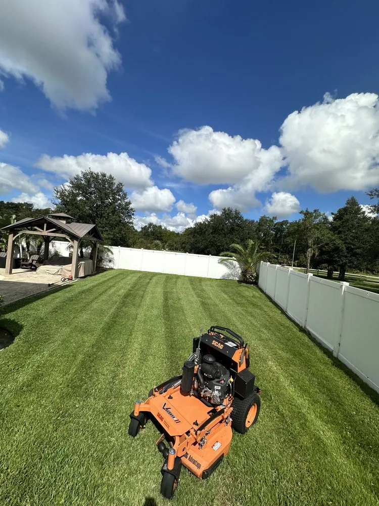 Top-rated lawn mowing service with custom design in Winter Springs, FL by RET lawn service and Landscaping