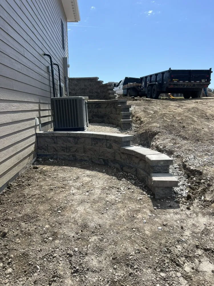 Expert lawn care service with custom design in Des Moines, IA by Rethink Hardscaping