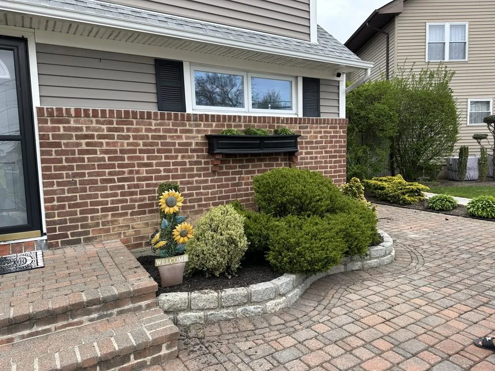 Reliable yard cleanup service with custom design in West Islip, NY by Revamp Homes