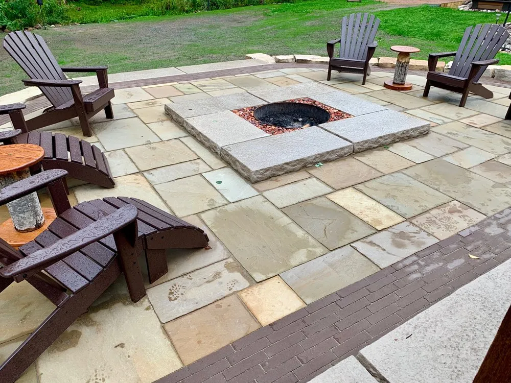 Trusted lawn mowing service for homes in Wausau, WI by Revi Design