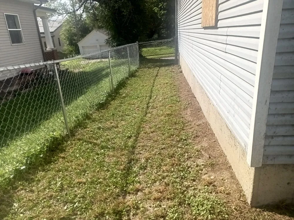 Affordable yard cleanup service in Saint Joseph, MO by Reynolds Lawn Service
