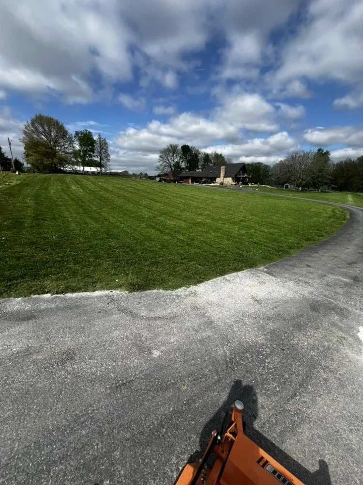 Professional lawn care service for year-round maintenance across Lee's Summit, MO - Rhyno Fix