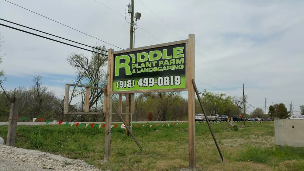 Custom landscape installation in Broken Arrow, OK by Riddle Plant Farm & Landscaping